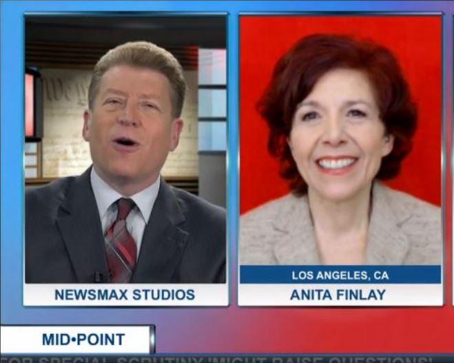News anchor interviewing Anita Finlay on NewsmaxTV.