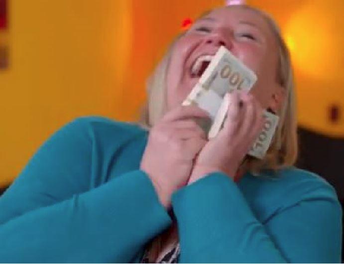 Happy woman holding two bundles of cash featured in the "Is Poverty Porn the New Trend in Reality TV?" blog.