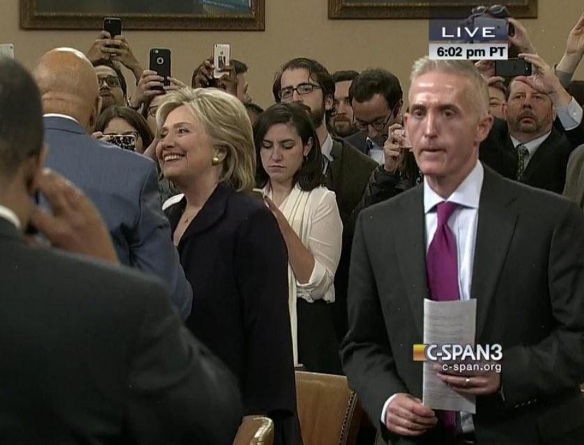 Hillary shaking hands in a screen grab featured in the "Hillary’s Grit Under Pressure Wins New Supporters" blog.